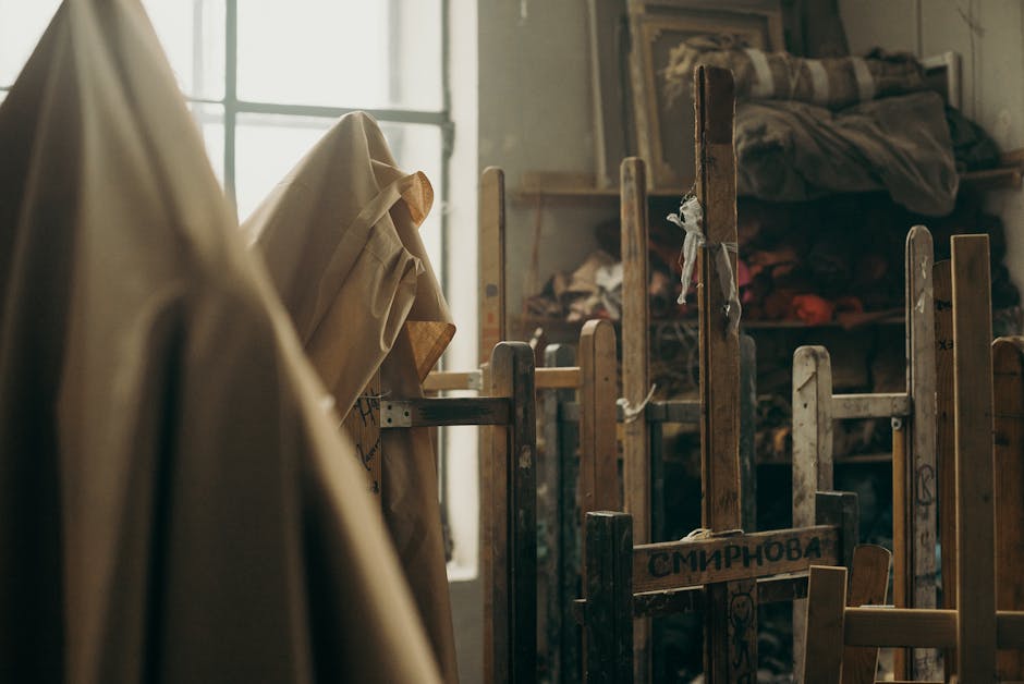 A warm and artistic space featuring wooden easels and cloths, perfect for creative expressions.